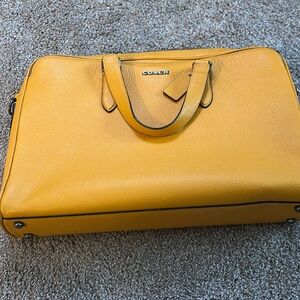 Yellow Coach Brief.  Used twice.Clean and spacious inside. Price is fair & firm!